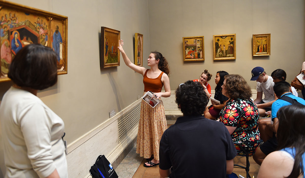 Student pointing at painting at National Gallery of Art